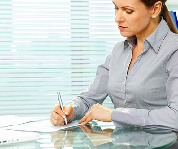signing-documents-woman-office.jpg